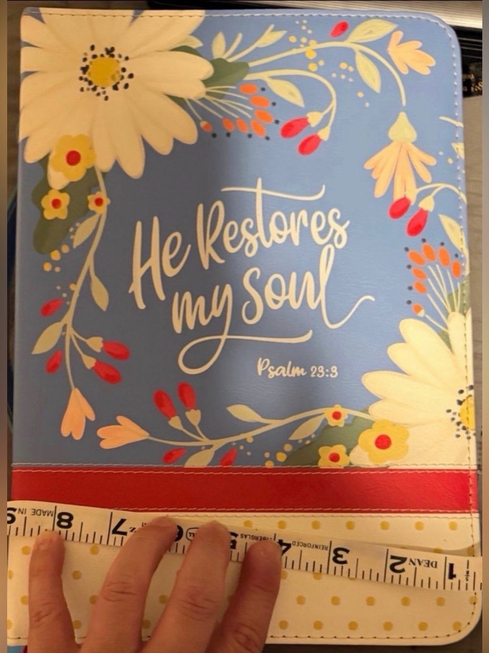 Soft faux leather Bible cover with floral print. Light blue background with whit